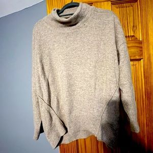 Beautiful cashmere sweater. Wore few times. Comes from smoke free home.